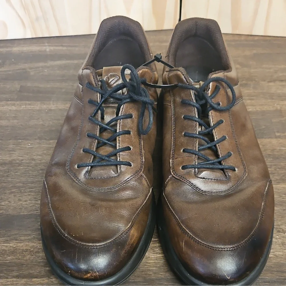 These are ECCO Aquet Men's Sneakers in a rich, dark brown leather finish.